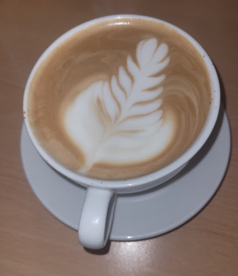 Latte art on a flat white made at Cafe Mews
